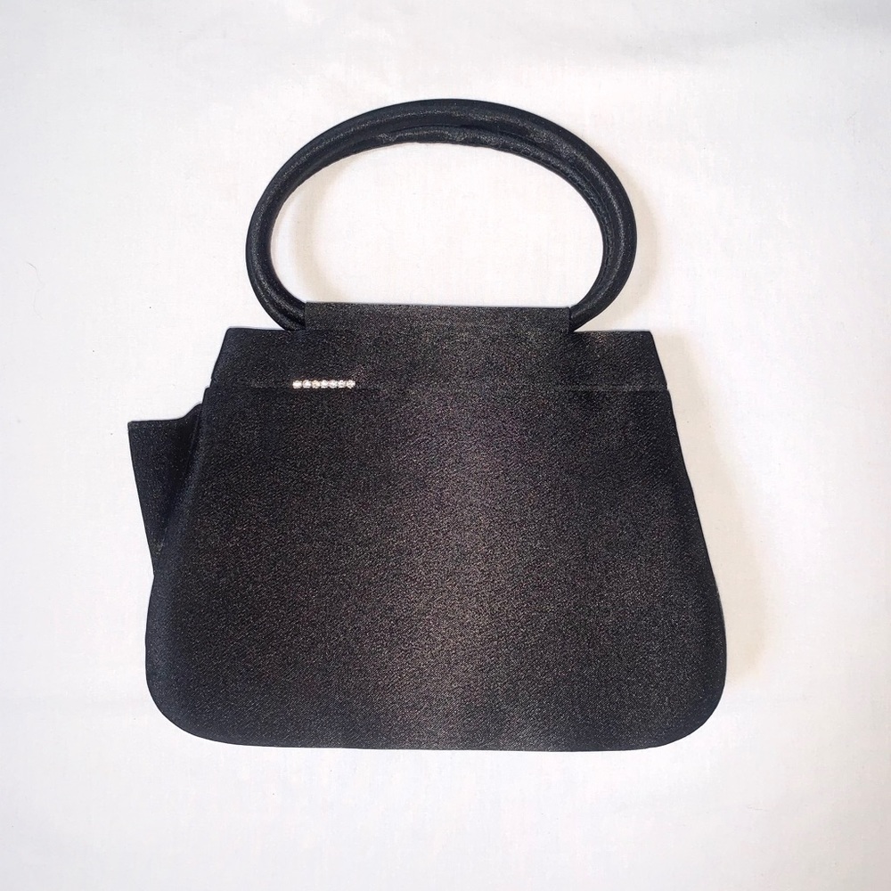 Black “like-new” purse with rhinestone accent.